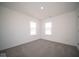 Bright bedroom with grey carpet and large windows at 7888 Magnolia St, New Palestine, IN 46163