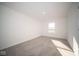 Bright bedroom with a window and carpet flooring at 7888 Magnolia St, New Palestine, IN 46163