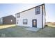 House exterior showcasing white siding and patio at 7888 Magnolia St, New Palestine, IN 46163