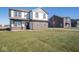 Two-story house with a front yard and a neighboring home at 7888 Magnolia St, New Palestine, IN 46163