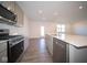 Modern kitchen with stainless steel appliances and an island at 7888 Magnolia St, New Palestine, IN 46163