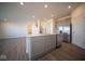 Modern kitchen with island, stainless steel appliances, and access to backyard at 7888 Magnolia St, New Palestine, IN 46163