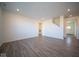 Spacious living room with wood-look floors and plenty of natural light at 7888 Magnolia St, New Palestine, IN 46163