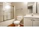 Basement bathroom with shower/tub combo and white vanity at 6918 Ralph Ct, Indianapolis, IN 46220