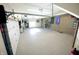 Finished garage with epoxy flooring and wall-mounted storage at 4270 Victoria Ln, Avon, IN 46123