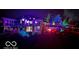 Back exterior of house with colorful lighting at night at 4270 Victoria Ln, Avon, IN 46123