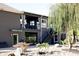 Modern gray home with a unique, multi-level design and exterior stairs at 4270 Victoria Ln, Avon, IN 46123