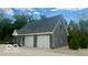 Detached three car garage with gray brick exterior at 4270 Victoria Ln, Avon, IN 46123
