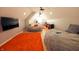Large bonus room with two beds, a TV, and plenty of storage at 4270 Victoria Ln, Avon, IN 46123