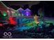 Landscaped front yard with colorful lighting at night at 4270 Victoria Ln, Avon, IN 46123