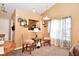 Living room with two comfortable armchairs, a small table, and a view of the kitchen at 10722 Lostpine Ln, Indianapolis, IN 46235