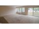 Spacious living room with wall-to-wall carpet and sliding doors to balcony at 25 E 40Th St # Apt 3E, Indianapolis, IN 46205