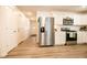 Modern kitchen with stainless steel appliances and white cabinets at 1431 Coen Ct, Columbus, IN 47201