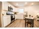 Modern kitchen with stainless steel appliances and white cabinets at 1431 Coen Ct, Columbus, IN 47201