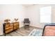 Bright bedroom with a comfy bed, dresser, and large window at 1431 Coen Ct, Columbus, IN 47201
