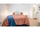 Serene bedroom with coral bedding and en-suite bathroom access at 1431 Coen Ct, Columbus, IN 47201