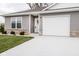 Modern home with gray siding and white garage door at 1431 Coen Ct, Columbus, IN 47201