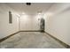 Unfinished garage with concrete floor and overhead door at 1431 Coen Ct, Columbus, IN 47201