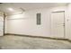 Unfinished garage with concrete floor and overhead door at 1431 Coen Ct, Columbus, IN 47201