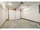 Unfinished garage with concrete floor and overhead door at 1431 Coen Ct, Columbus, IN 47201