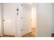 Bright hallway with white doors and light oak flooring at 1431 Coen Ct, Columbus, IN 47201