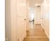Bright hallway with light flooring and white doors at 1431 Coen Ct, Columbus, IN 47201