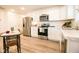 Modern kitchen with stainless steel appliances and white cabinets at 1431 Coen Ct, Columbus, IN 47201