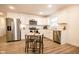 Modern kitchen with white cabinets, stainless steel appliances, and a breakfast nook at 1431 Coen Ct, Columbus, IN 47201