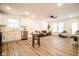 Open floor plan with white cabinets, stainless steel appliances, and light flooring at 1431 Coen Ct, Columbus, IN 47201