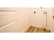 Small laundry area with hookups and flooring at 1431 Coen Ct, Columbus, IN 47201