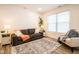 Relaxing living room with a sofa and armchair near a window at 1431 Coen Ct, Columbus, IN 47201