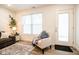 Comfortable living room with an armchair, large window, and stylish rug at 1431 Coen Ct, Columbus, IN 47201