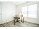 Home office with a desk, chair, and window with blinds at 1431 Coen Ct, Columbus, IN 47201