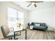 Home office with a desk, couch, and large window at 1431 Coen Ct, Columbus, IN 47201