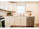 Clean kitchen with white cabinets and stainless steel dishwasher at 1431 Coen Ct, Columbus, IN 47201