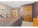 Spacious bedroom with wood door and dresser at 4525 S Deck Rd, Gosport, IN 47433