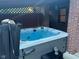 Relax in this outdoor hot tub, nestled beside a brick wall at 4525 S Deck Rd, Gosport, IN 47433