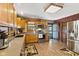 Eat-in kitchen with oak cabinets, stainless steel appliances, and granite countertops at 4525 S Deck Rd, Gosport, IN 47433