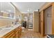 Elegant bathroom with double vanity, large mirror, and walk-in shower at 4525 S Deck Rd, Gosport, IN 47433
