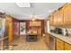 Open kitchen with oak cabinets, stainless steel appliances, and breakfast nook at 4525 S Deck Rd, Gosport, IN 47433