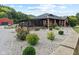 Brick ranch house with a screened porch and landscaped front yard at 4525 S Deck Rd, Gosport, IN 47433