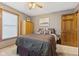 Bright bedroom with a double bed and wood closet at 4525 S Deck Rd, Gosport, IN 47433