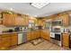 Spacious kitchen with oak cabinets, stainless steel appliances, and granite countertops at 4525 S Deck Rd, Gosport, IN 47433