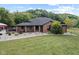Brick ranch house with a screened porch and landscaped front yard at 4525 S Deck Rd, Gosport, IN 47433