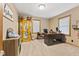 Home office with built-in shelving and large windows at 4525 S Deck Rd, Gosport, IN 47433