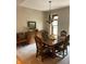 Elegant dining room with a large table, buffet, and chandelier at 466 Sycamore Ridge Ct, Avon, IN 46123