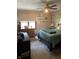 Spacious bedroom with wood flooring, ceiling fan, and ample natural light at 466 Sycamore Ridge Ct, Avon, IN 46123