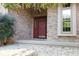 House entrance with red door and brick facade at 466 Sycamore Ridge Ct, Avon, IN 46123