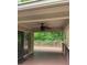 Relaxing deck overlooking wooded backyard with ceiling fan at 466 Sycamore Ridge Ct, Avon, IN 46123