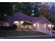 Brick ranch house with two-car garage, lit at night at 466 Sycamore Ridge Ct, Avon, IN 46123